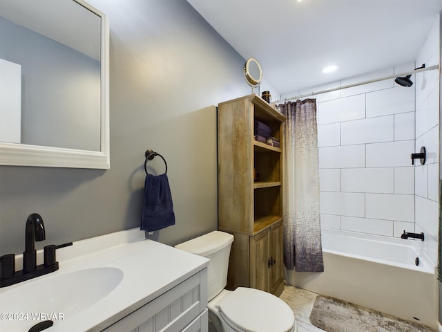 full bathroom with shower / tub combo, toilet, and sink