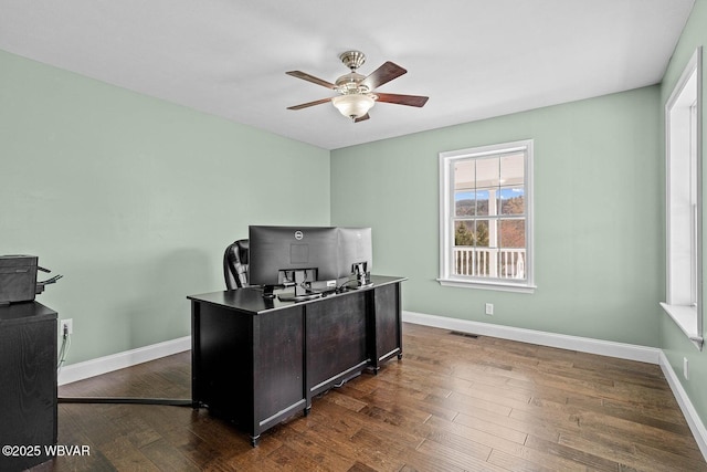 office with ceiling fan, dark wood finished floors, and baseboards