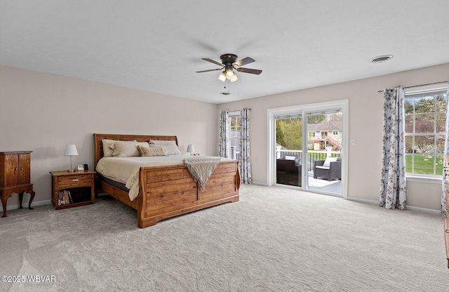carpeted bedroom featuring access to exterior, baseboards, and ceiling fan