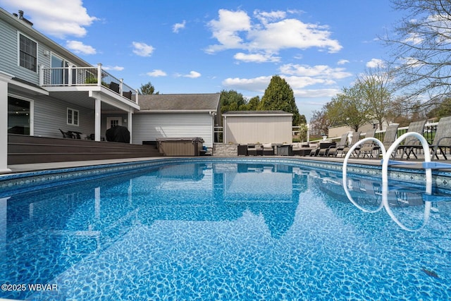 view of pool featuring an outdoor structure and a patio