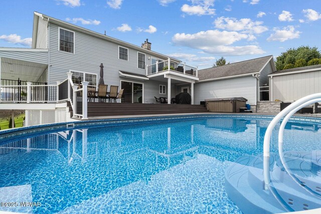 outdoor pool with a hot tub