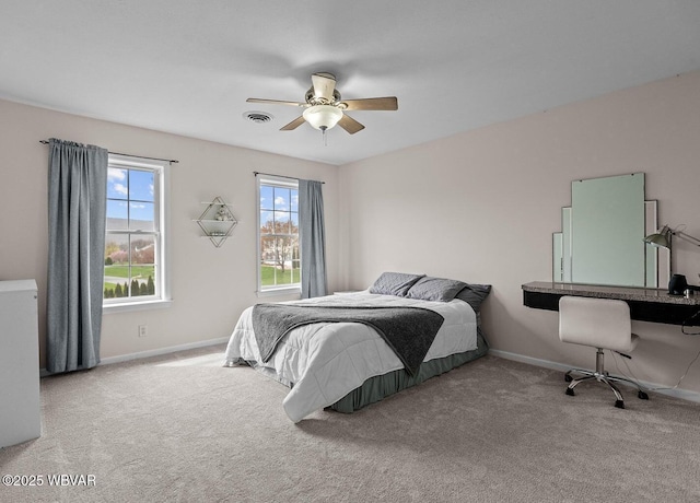 bedroom featuring carpet, baseboards, and a ceiling fan