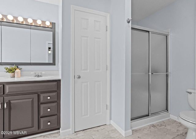 full bathroom featuring marble finish flooring, toilet, a stall shower, and baseboards