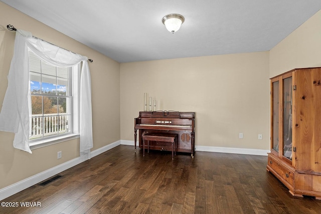 sitting room featuring wood finished floors and baseboards