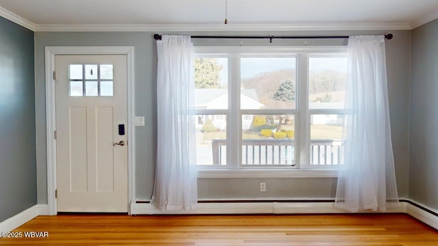 doorway to outside featuring plenty of natural light and light hardwood / wood-style floors