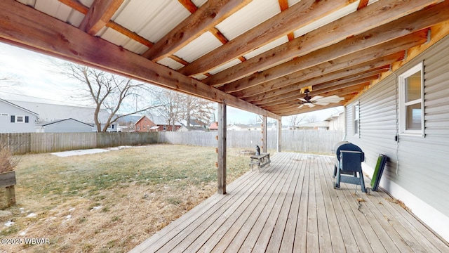 deck featuring grilling area, a yard, and ceiling fan