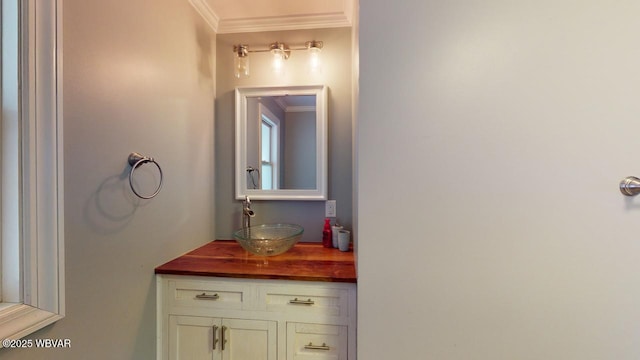 bathroom with vanity and crown molding