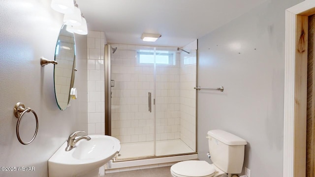 bathroom with walk in shower, toilet, and sink