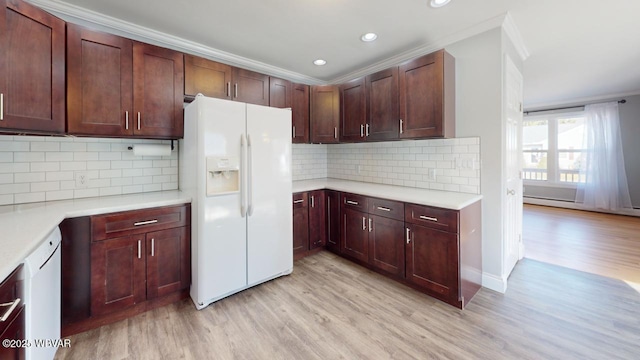 kitchen featuring crown molding, white appliances, tasteful backsplash, and light hardwood / wood-style flooring