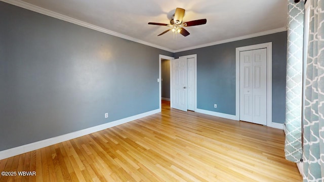 unfurnished bedroom featuring crown molding, ceiling fan, and light wood-type flooring