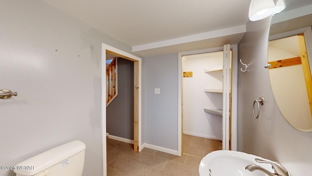 bathroom featuring sink and toilet