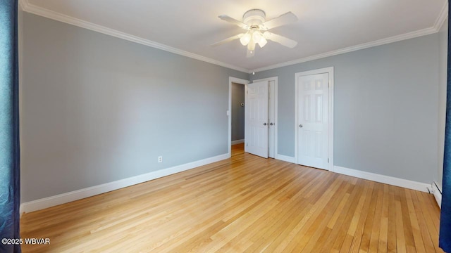 spare room with crown molding, ceiling fan, and light wood-type flooring