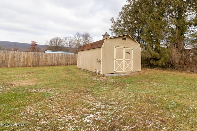 view of outbuilding featuring a yard