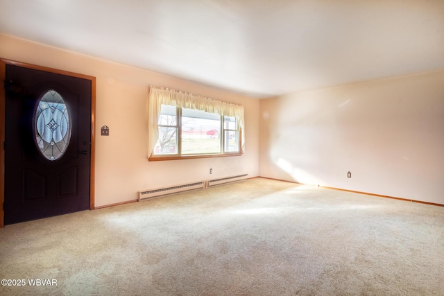 foyer with carpet floors and a baseboard radiator