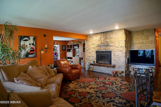 living area featuring a stone fireplace
