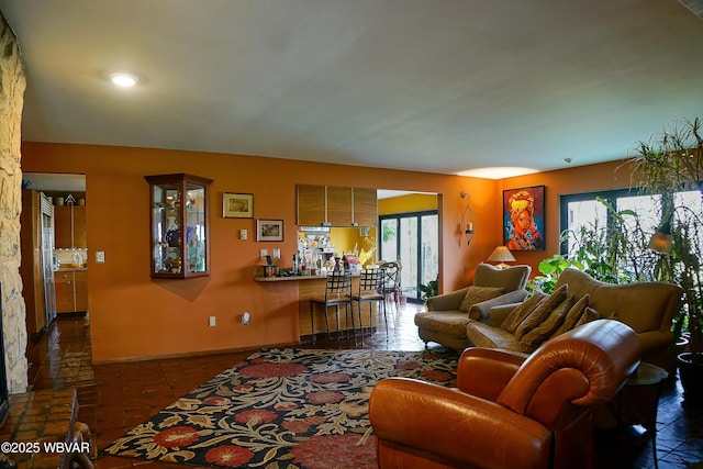 living area featuring baseboards