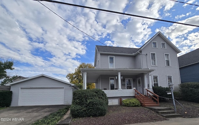 view of front facade featuring an outbuilding, a porch, and a garage