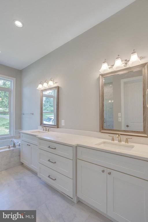 bathroom featuring tile flooring, plenty of natural light, and dual bowl vanity