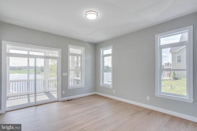 spare room with light wood-type flooring