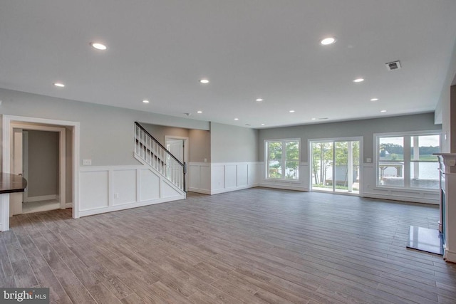 unfurnished living room featuring hardwood / wood-style floors