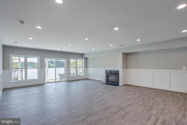 unfurnished living room with light wood-type flooring