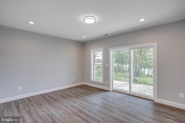 spare room with dark wood-type flooring