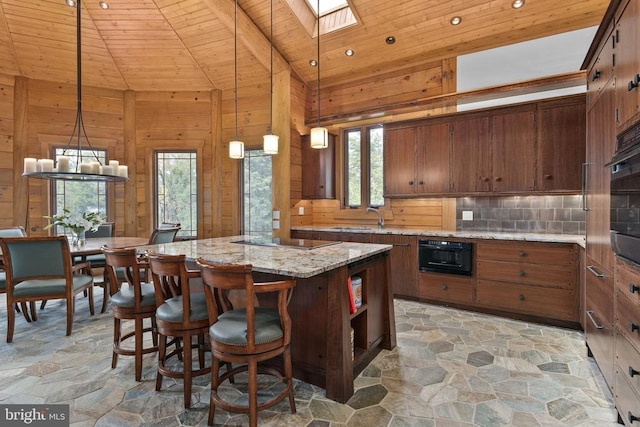 kitchen featuring wood ceiling, plenty of natural light, a kitchen island, and decorative light fixtures