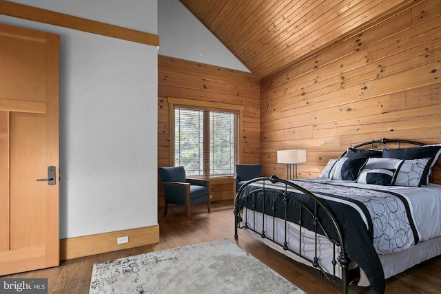 bedroom featuring dark hardwood / wood-style flooring, wooden walls, wood ceiling, and lofted ceiling