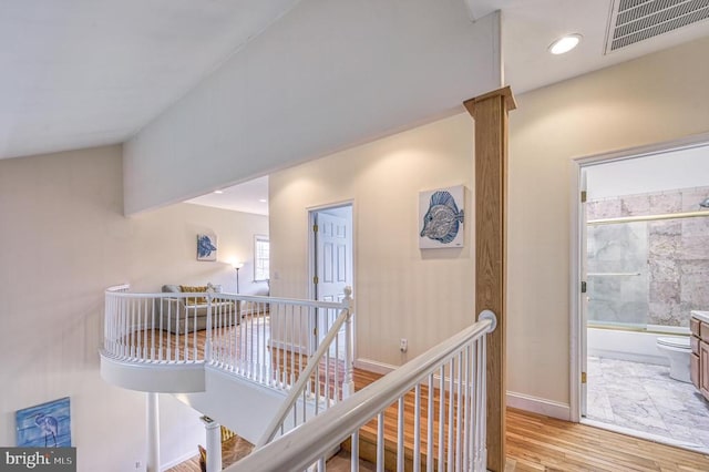 corridor with light hardwood / wood-style flooring