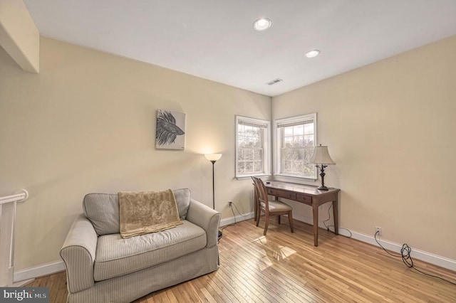 living area featuring light hardwood / wood-style floors