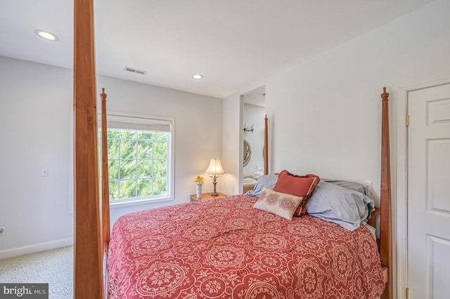 bedroom featuring light colored carpet