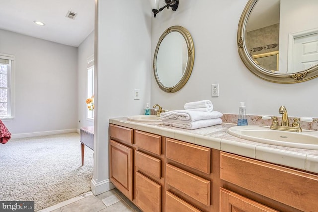 bathroom featuring tile floors, double sink, and oversized vanity