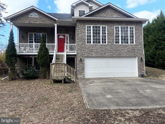 view of front facade featuring covered porch and a garage