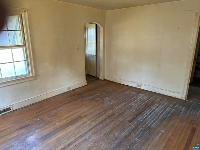 empty room featuring dark hardwood / wood-style flooring