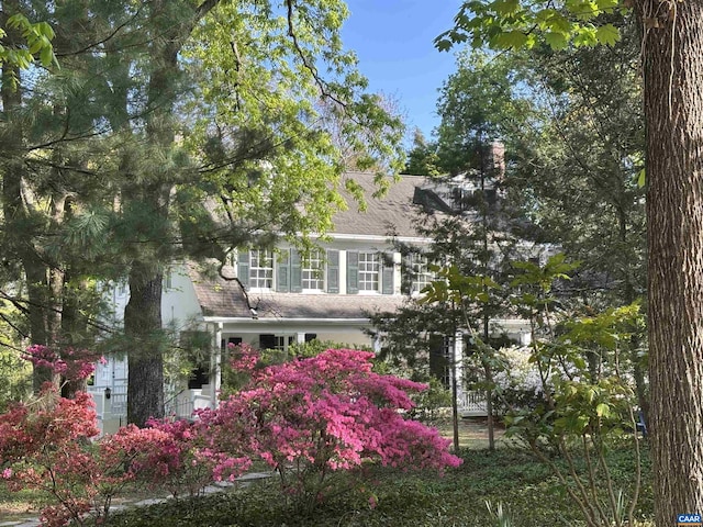 view of front of home featuring a chimney