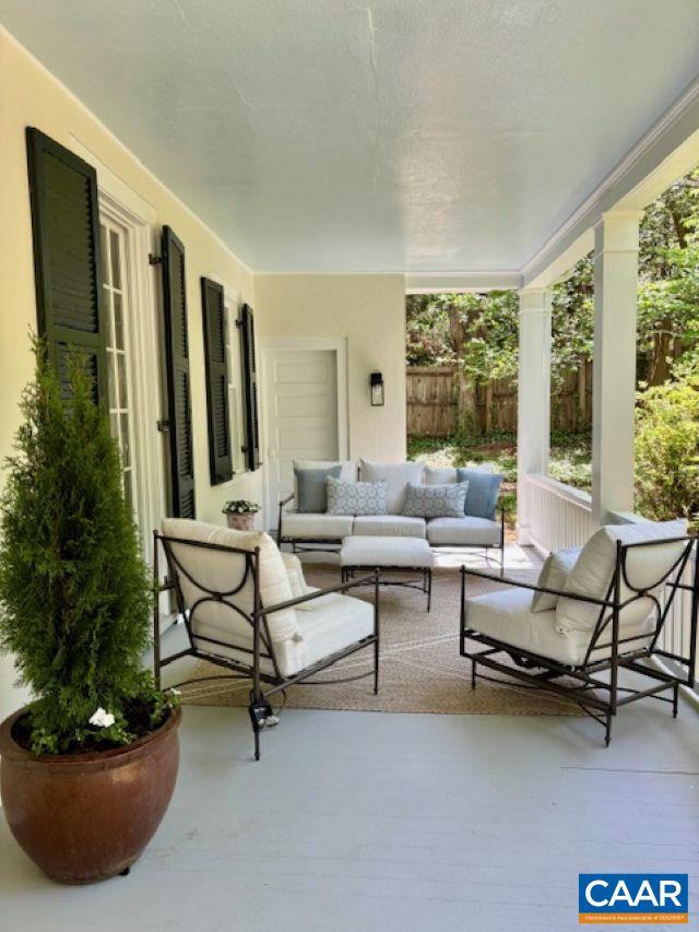 view of patio / terrace with fence and an outdoor living space