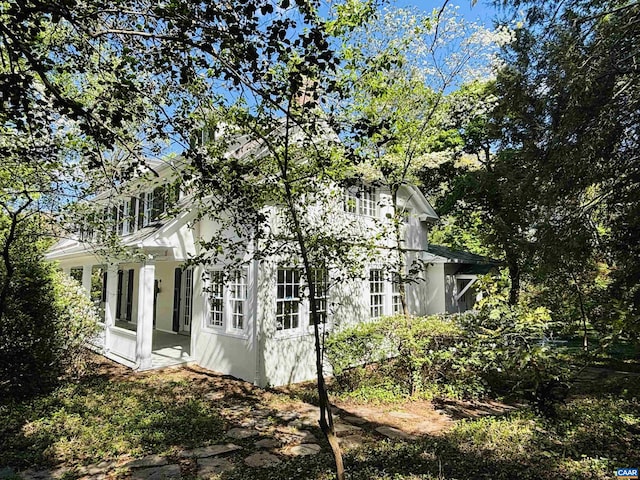 view of side of home featuring stucco siding