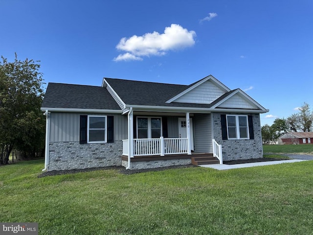 view of front facade with a front lawn and a porch