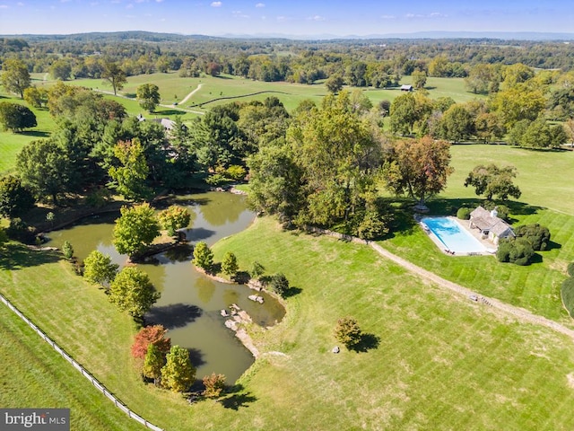 aerial view with a rural view and a water view