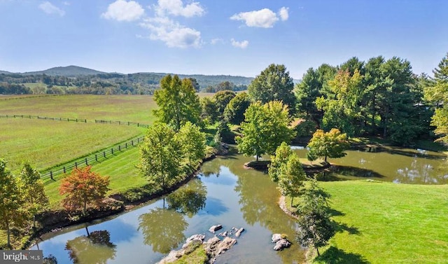 bird's eye view with a rural view and a water and mountain view