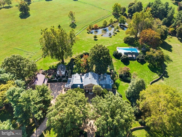 birds eye view of property with a water view and a rural view