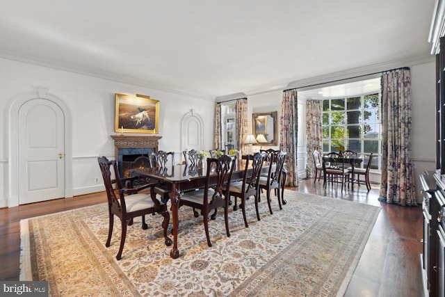 dining area with dark hardwood / wood-style floors and ornamental molding