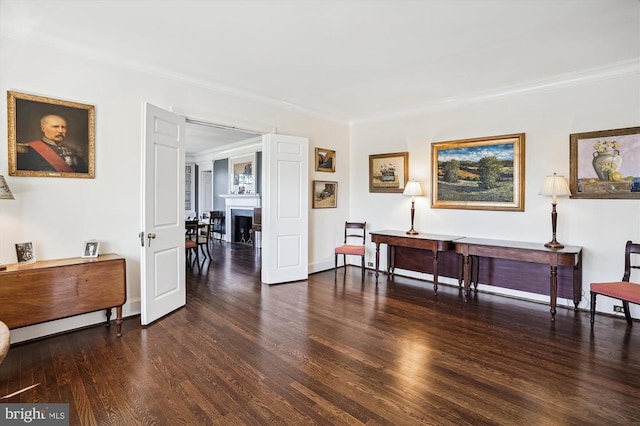 interior space with crown molding and dark wood-type flooring