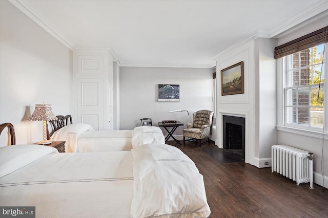 bedroom featuring radiator heating unit, dark wood-type flooring, and crown molding