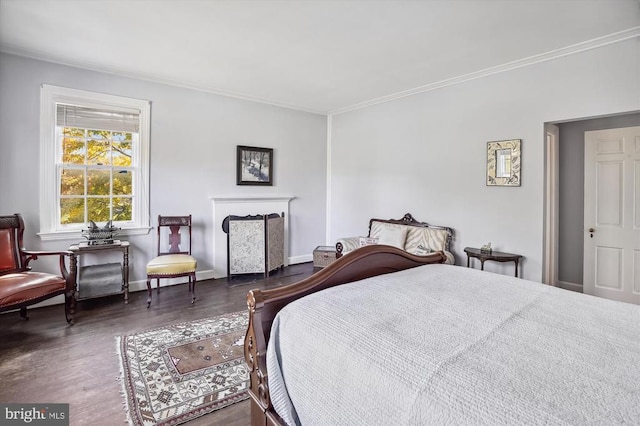 bedroom featuring ornamental molding and dark hardwood / wood-style flooring