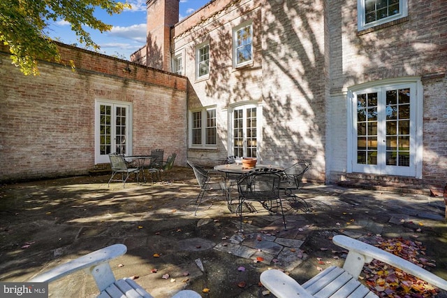 back of house with french doors and a patio