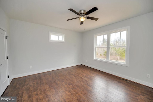 unfurnished room featuring dark hardwood / wood-style flooring and ceiling fan