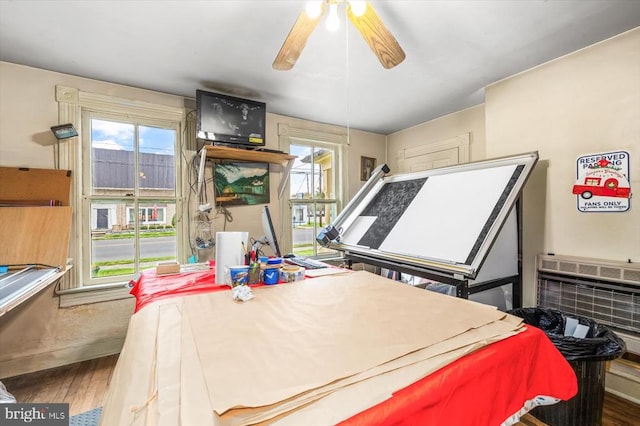 bedroom featuring wood-type flooring and ceiling fan