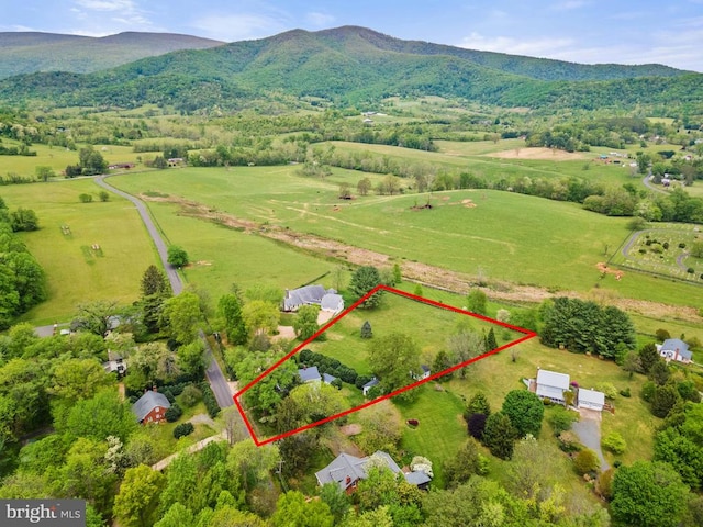 bird's eye view featuring a rural view and a mountain view