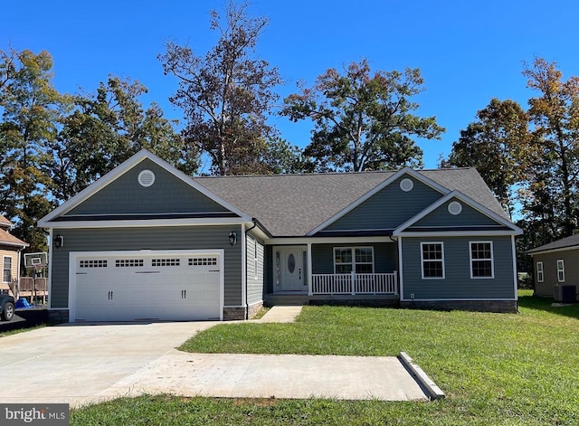 view of front of house featuring a porch, a garage, a front yard, and central AC